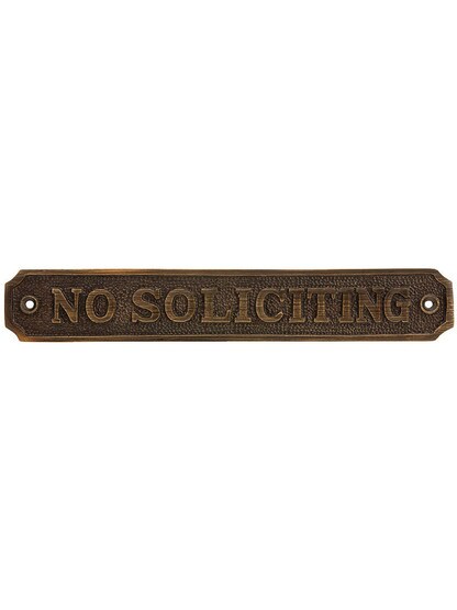 Cast Brass No Soliciting Sign in Antique Brass.